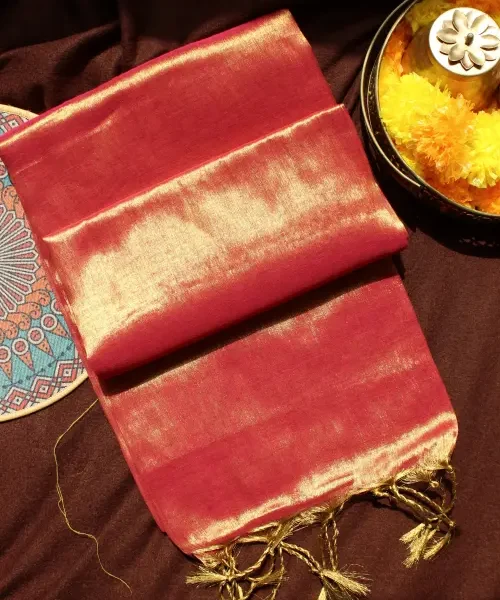 Dual tone golden orange tissue saree with red border