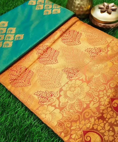 Bluish green tissue silk saree with red zari woven pallu